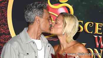 Rita Ora packs on the PDA with husband Taika Waititi as she sizzles in a daring sheer fishtail gown at the premiere of Disney's Descendants: Wicked Wonderland