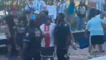 Now the Argentines are fighting EACH OTHER! Rival football fans clash on eve of 'highest risk' World Cup match with England