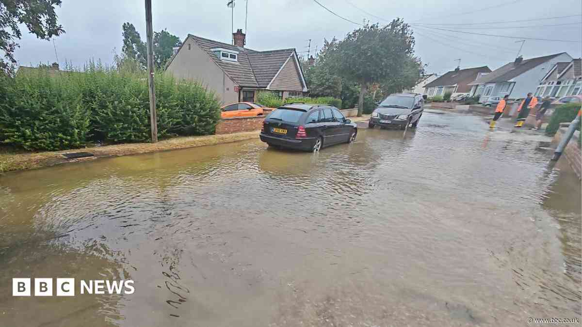 Burst water main floods homes and closes roads