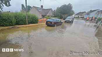 Burst water main floods homes and closes roads