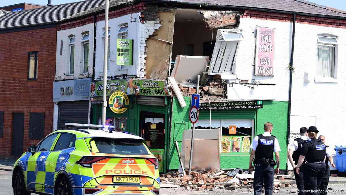 Building collapses onto road as emergency services descend