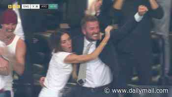 Victoria Beckham leaps into David's arms as she celebrates England's goal against Argentina after she became an instant meme for failing to react