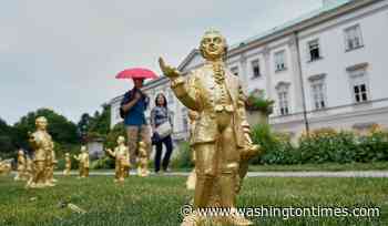 A horde of golden mini-Mozarts marks 270 years since the composer's birth in Salzburg