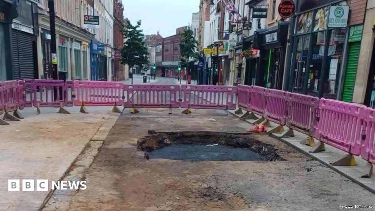Town centre road closed after water main bursts