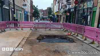 Town centre road closed after water main bursts