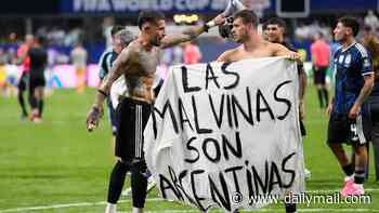Argentina players hold banner claiming the Falkland Islands after knocking England out of the World Cup