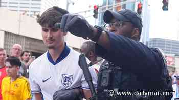 Aggro on the streets of Atlanta: Armed police arrest England fans as supporters spill out of stadium following Three Lions' loss