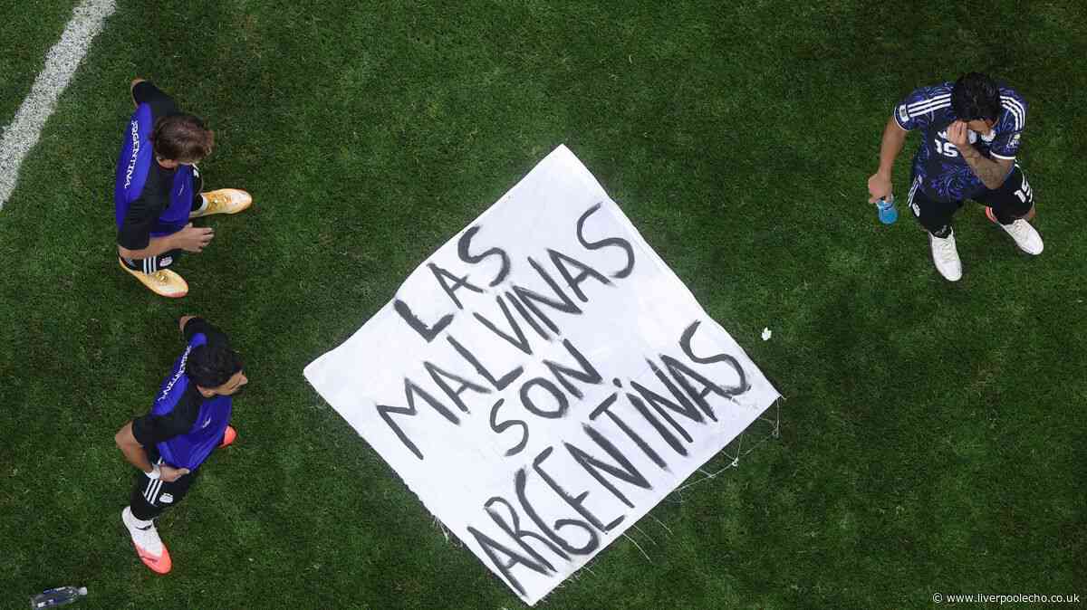Argentina players wave 'The Falklands belong to us' banner in taunt to England after World Cup exit