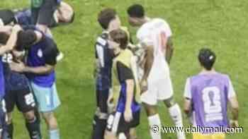 New footage emerges of Jude Bellingham clashing with jubilant Argentina players on the pitch as they celebrate sending England home from the World Cup