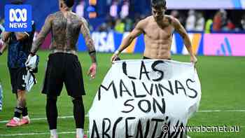 Argentina stars hold up Falklands banner after World Cup win over England