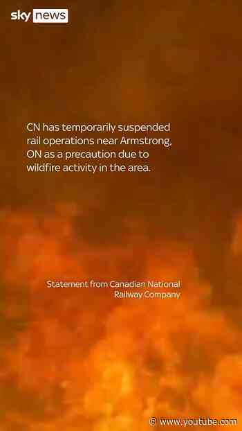 Train engulfed by wall of flames in Canada wildfire