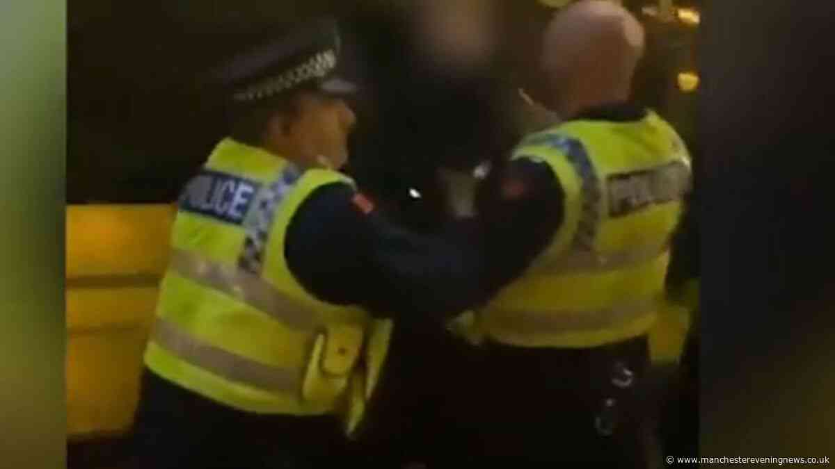 GMP cop under investigation after he's filmed arresting protester in Manchester city centre is exonerated after five years