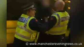 GMP cop under investigation after he's filmed arresting protester in Manchester city centre is exonerated after five years