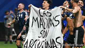 Argentina players hold up Falklands banner after World Cup semi-final win