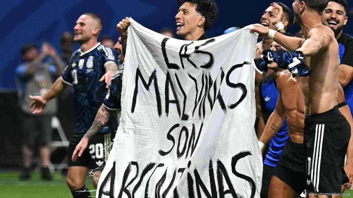 Argentina players hold up Falklands banner after World Cup semi-final win