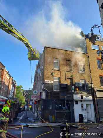 Firefighters battle blaze at central London restaurant as residents flee homes