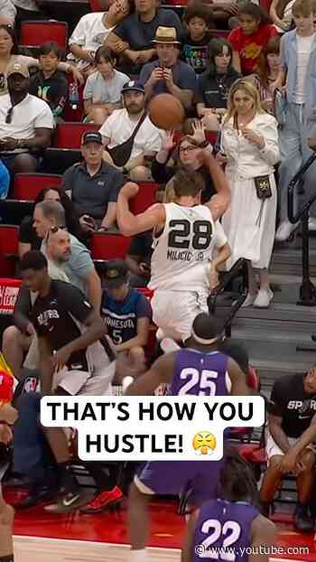 Milicic Jr. goes all the way into the stands to save it!