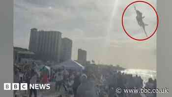 Moment US Navy jet stuns packed Florida beach with low flypast