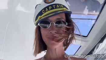 Myleene Klass, 48, poses in her signature white bikini on a boat trip 20 years after her iconic I'm A Celebrity shower moment