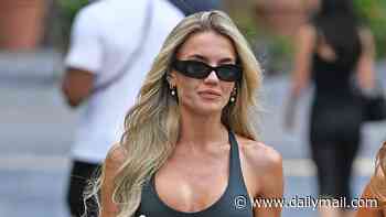 Molly Smith puts on a leggy display in a black mini dress while out shopping in Manchester ahead of her wedding to Tom Clare