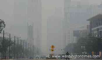 Wildfire smoke makes air unhealthy from the U.S. Midwest to East Coast. Officials say stay inside
