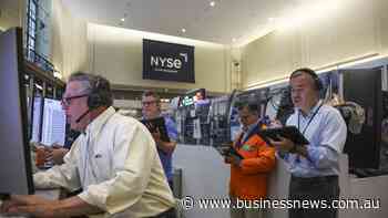 Wall St falls as chip weakness offsets solid earnings