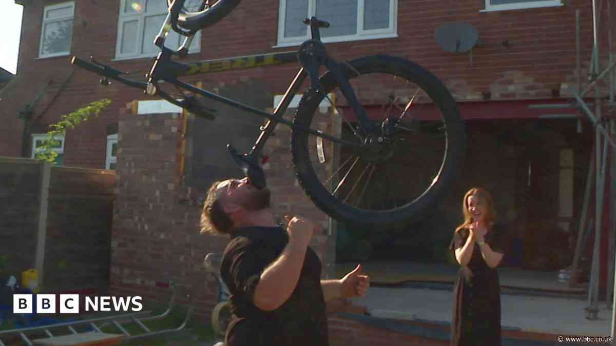 The man who balances bikes, ladders and sheds on his chin