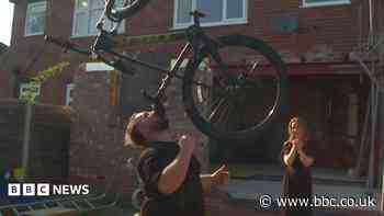 The man who balances bikes, ladders and sheds on his chin