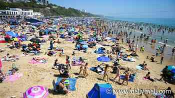 Woman is sexually assaulted while swimming off Bournemouth beach with her family as man, 35, is arrested