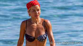 Rita Ora wears two-tone animal-print bikini as she enjoys a well-earned tour break on Spain's Mediterranean coast
