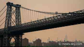 Wildfires force thousands to evacuate as smoke darkens skies over major cities