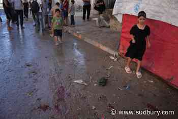 An Israeli strike on a funeral in Gaza kills 7 people and wounds 22, a local hospital says