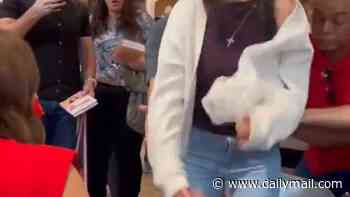 Christian woman has dramatic thrashing episode as she meets celebrity female pastor at book signing