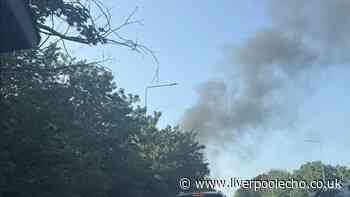 Black smoke billows across sky in Maghull as caravans go up in flames