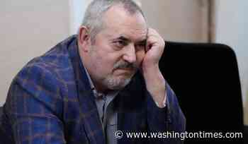 A Putin critic is convicted on charges that will keep him from campaigning for Russia's parliament