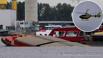 Drama in haven Amsterdam: opvarende gezonken duwboot vermist