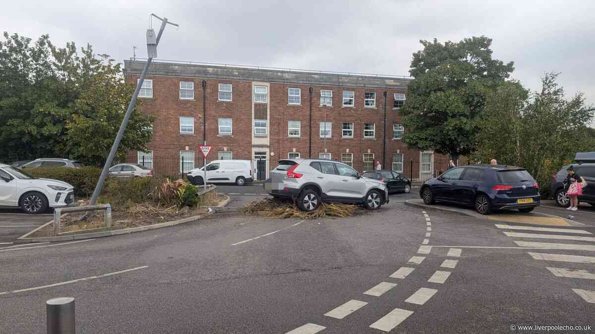 Rice Lane Aldi car park blocked after car smashes through barrier