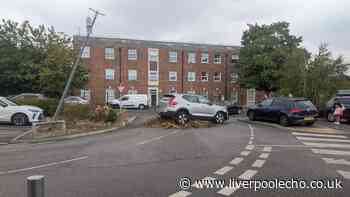 Rice Lane Aldi car park blocked after car smashes through barrier