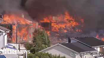 Helicopters dump water as huge Norway fire destroys homes