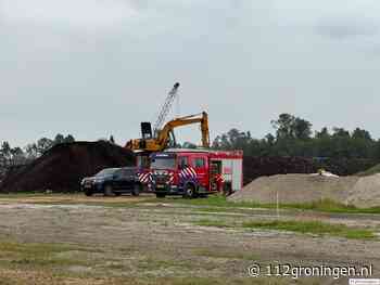 Mobiele kraan vat vlam op bouwplaats in Scheemda