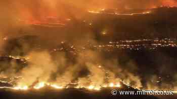 Terrifying footage shows wildfires tearing through popular holiday destination forcing 1,000 to flee