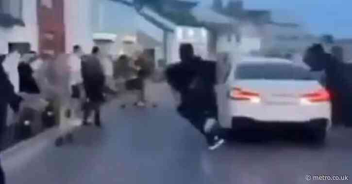 Three teenagers taken to hospital after car driven at crowd