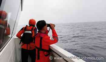 Rescuers in Indonesia find mother and son survivors from sunken passenger boat