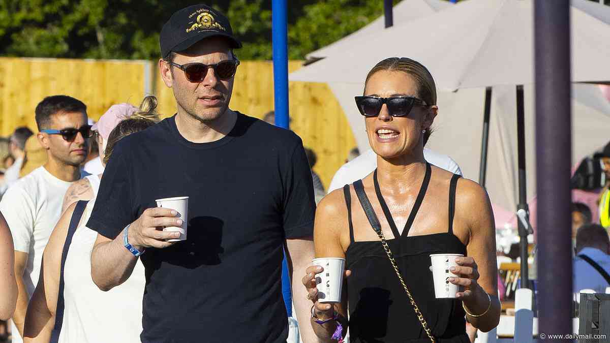 PICTURED: Smiling Cat Deeley puts on a tactile display with movie executive during intimate date at Lewis Capaldi concert - after splitting from husband of 12 years Patrick Kielty