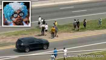 Moronic Argentina fans run across TEN LANE highway in desperate bid to make World Cup final in time as travel hellscape bites