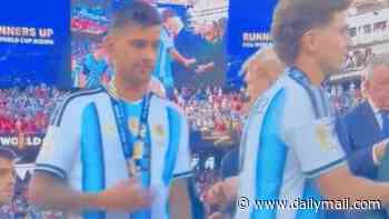 Argentina and Tottenham defender Cristian Romero SNUBS Donald Trump after collecting World Cup runners-up medal