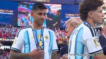 Argentina and Tottenham defender Cristian Romero SNUBS Donald Trump after collecting World Cup runners-up medal