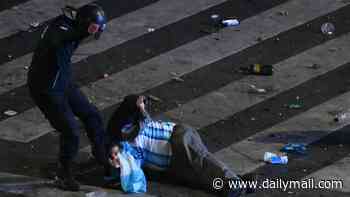 Angry Argentina fans clash with riot police in Buenos Aires after their players fought Spain rivals in ugly World Cup final scenes