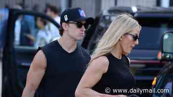 Ellie Goulding, 39, and boyfriend Beau Minniear, 29, display their muscular arms in matching tank tops as they leave the World Cup final