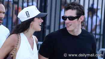 Dua Lipa accessorises with a World Cup hat as she and Callum Turner look like smitten newlyweds after attending star-studded final